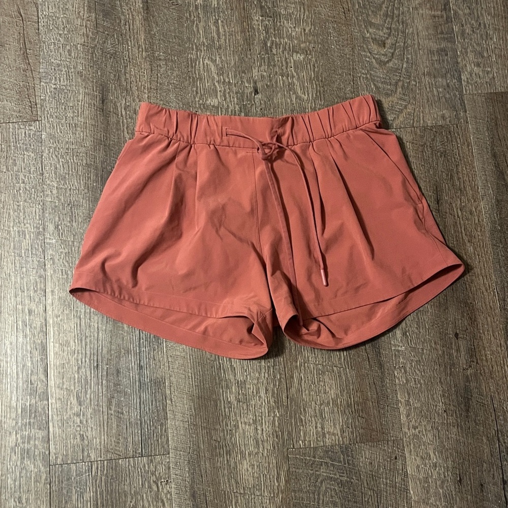 old lululemon shorts pink no tags inside pink logo on back size unsure small